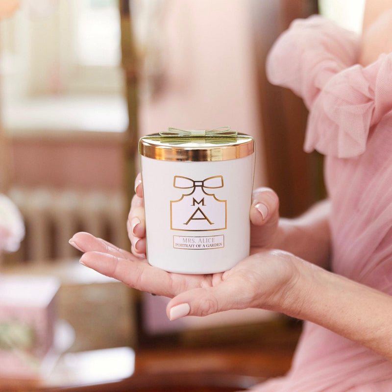 Elevate your bedtime routine with the Bonne Nuit Pink Giftscape, offering a Pink Sleeveless Nightdress, a soothing Rose Petal Scented Candle, and ten monogrammable Pink Chintz Pochettes.