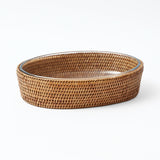 Rattan basket designed for carrying and serving casseroles.
