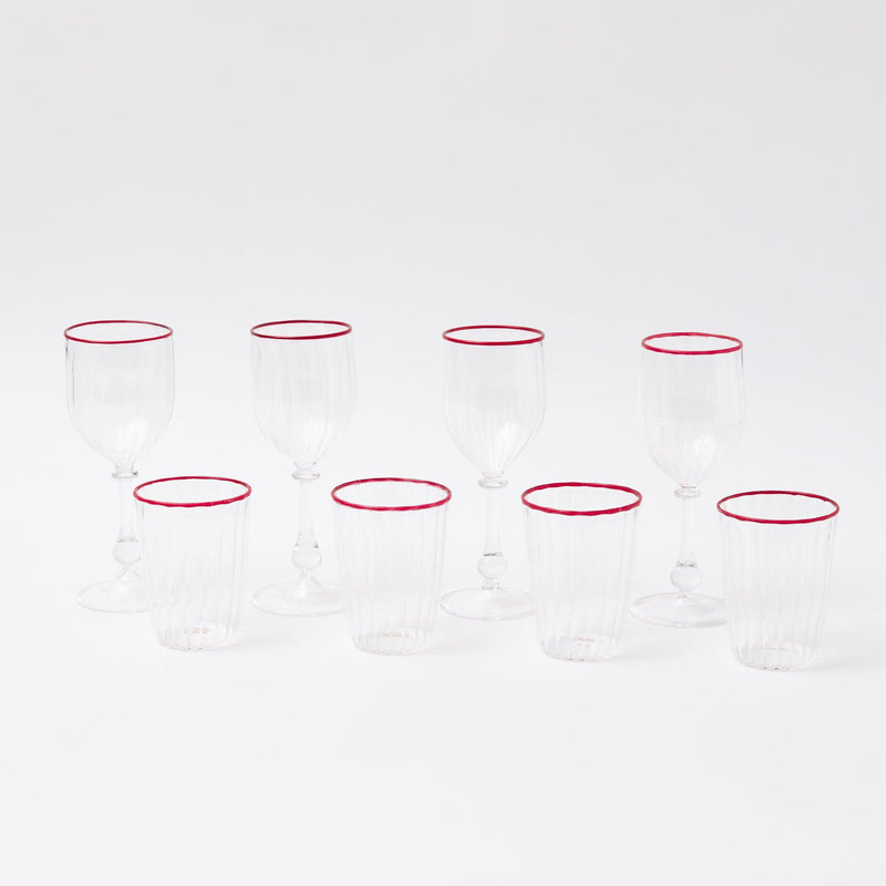 Make each holiday meal a celebration of tradition with our Set of 8 Red Rim Glassware, offering both water and wine glasses to cater to your guests' needs.