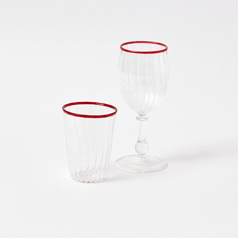 Celebrate the beauty of the season with our Red Rim Glassware Set, a must-have for adding a touch of Christmas cheer to your holiday celebrations, offering both water and wine glasses.