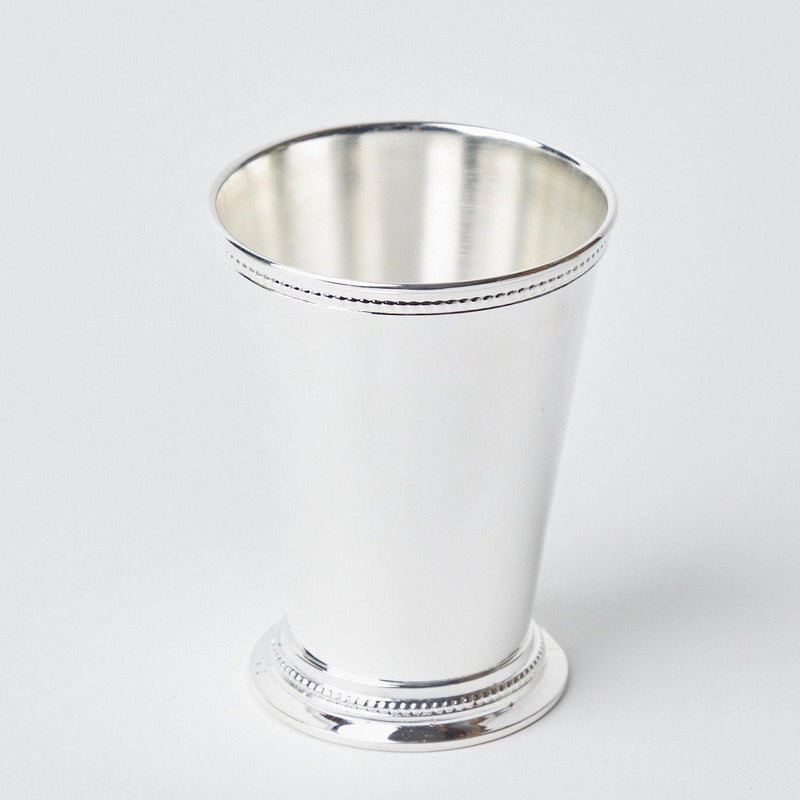 Add a touch of elegance and refinement to your drinking experience with the Silver Mint Julep Cups Pair, designed to bring sophistication to your table.