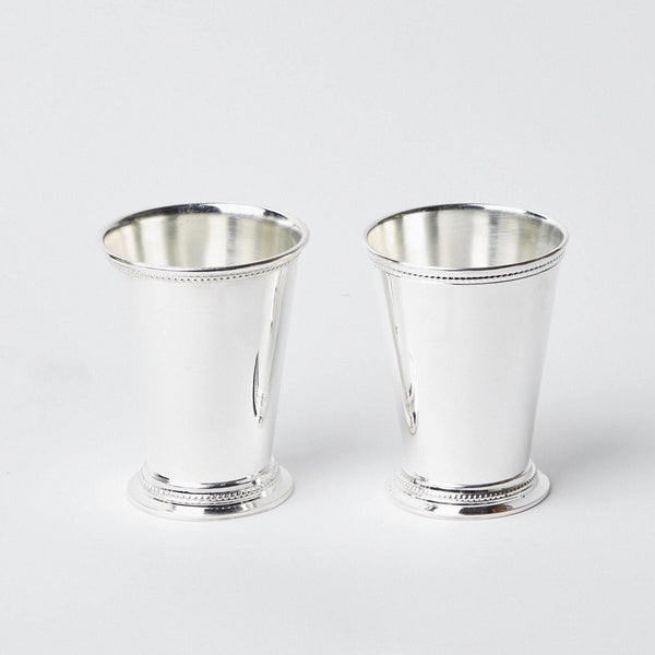 Elevate your beverage service with our Pair of Silver Mint Julep Cups - a touch of classic elegance for your drinks.