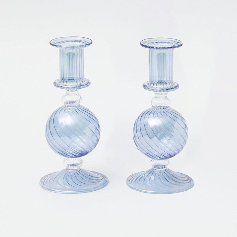 Elevate your home decor with the Small Camille Azure Candle Holders - a charming pair that adds an artistic and elegant flair to your living space.