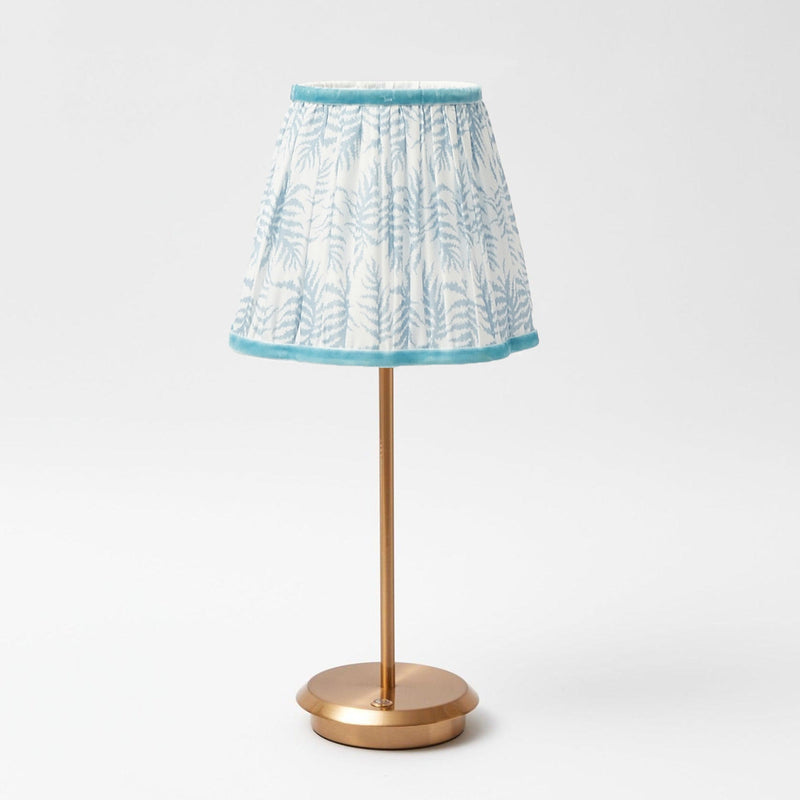 Impress your guests with the delightful charm of the Tall Rechargeable Table Lamp Stand, a piece that adds a touch of sophistication and the calming embrace of a blue lampshade to any room.