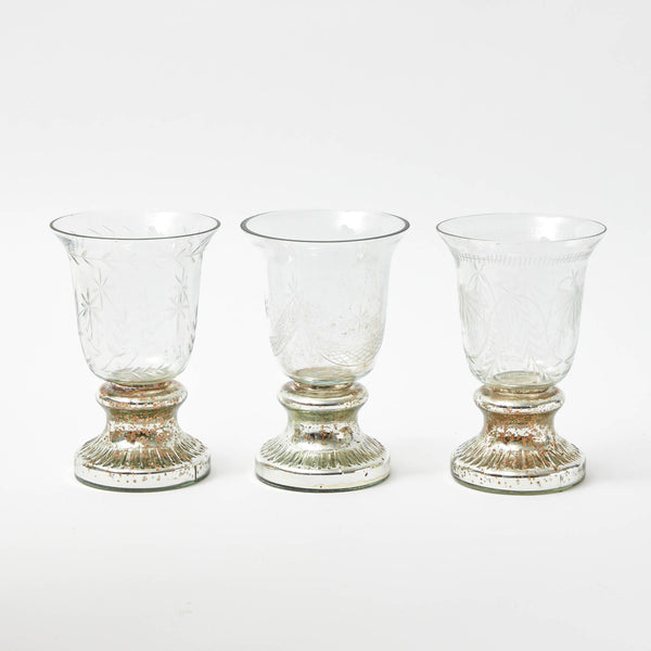 A charming set of medium Valesca etched flower and candle holders, perfect for adding a touch of elegance to your space.