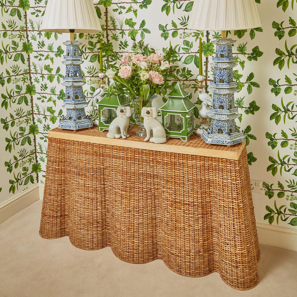 Embrace the beauty of nature-inspired design with the Vivienne Rattan Scalloped Console Table, ideal for infusing your home with a touch of coastal charm.