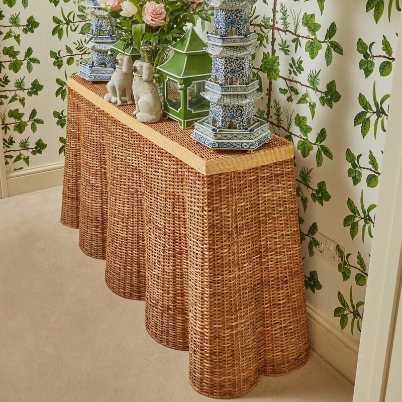 Enhance your interior with the warmth and inviting presence of the Vivienne Rattan Scalloped Console Table, designed to bring a touch of coastal beauty and style to your decor.