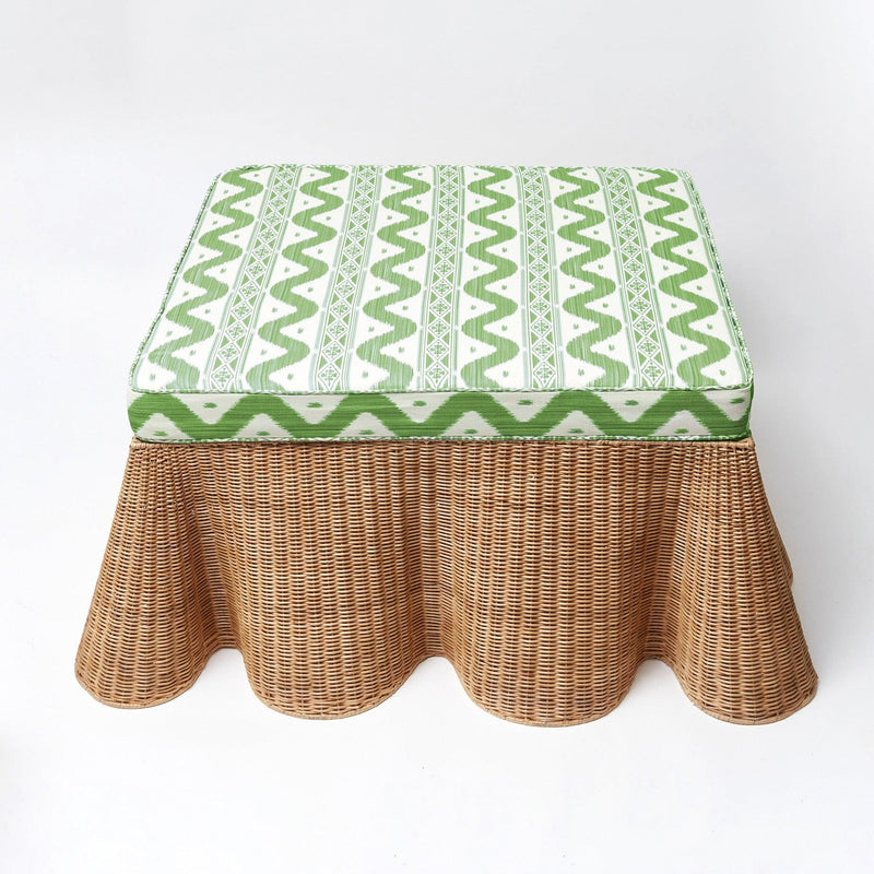 Turn your living space into a chic and functional statement with the Vivienne Rattan Scalloped Ottoman, a must-have for adding a touch of coastal beauty, versatile seating, and a unique flair to your decor.
