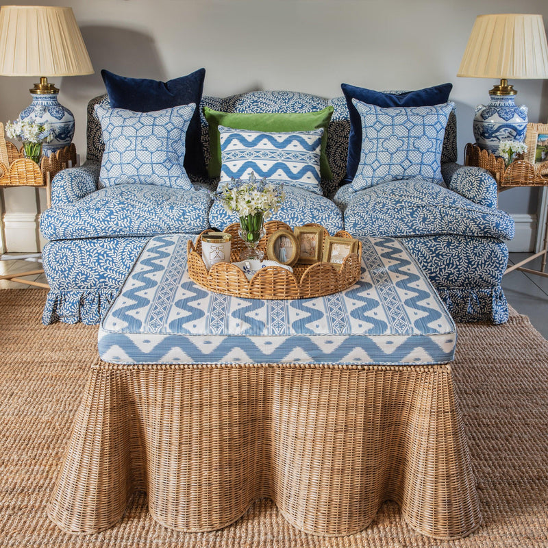 Embrace the beauty of nature-inspired design with the Vivienne Rattan Scalloped Ottoman, ideal for infusing your home with a touch of coastal charm and additional seating.