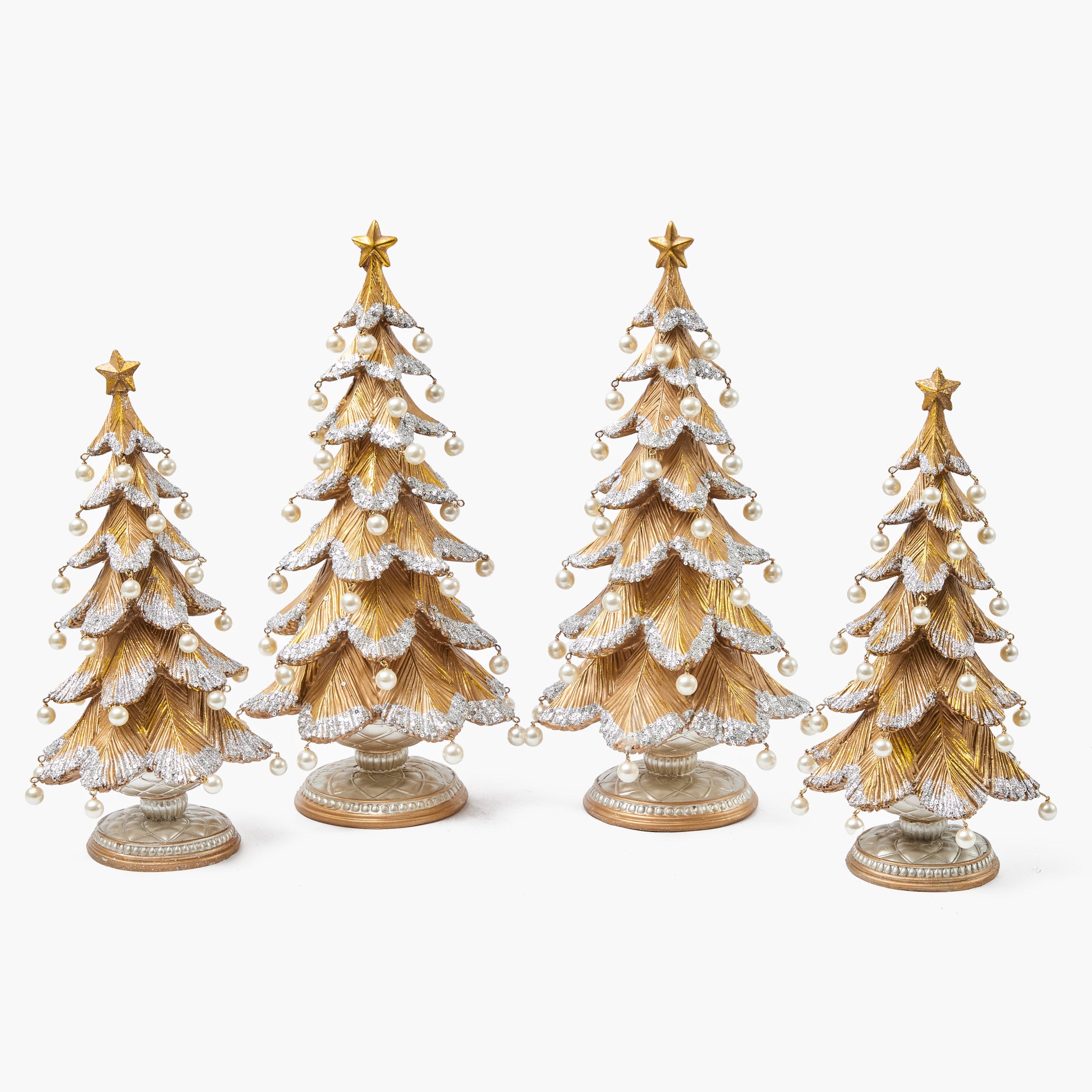 Four decorative Christmas trees with gold and silver accents on a white background