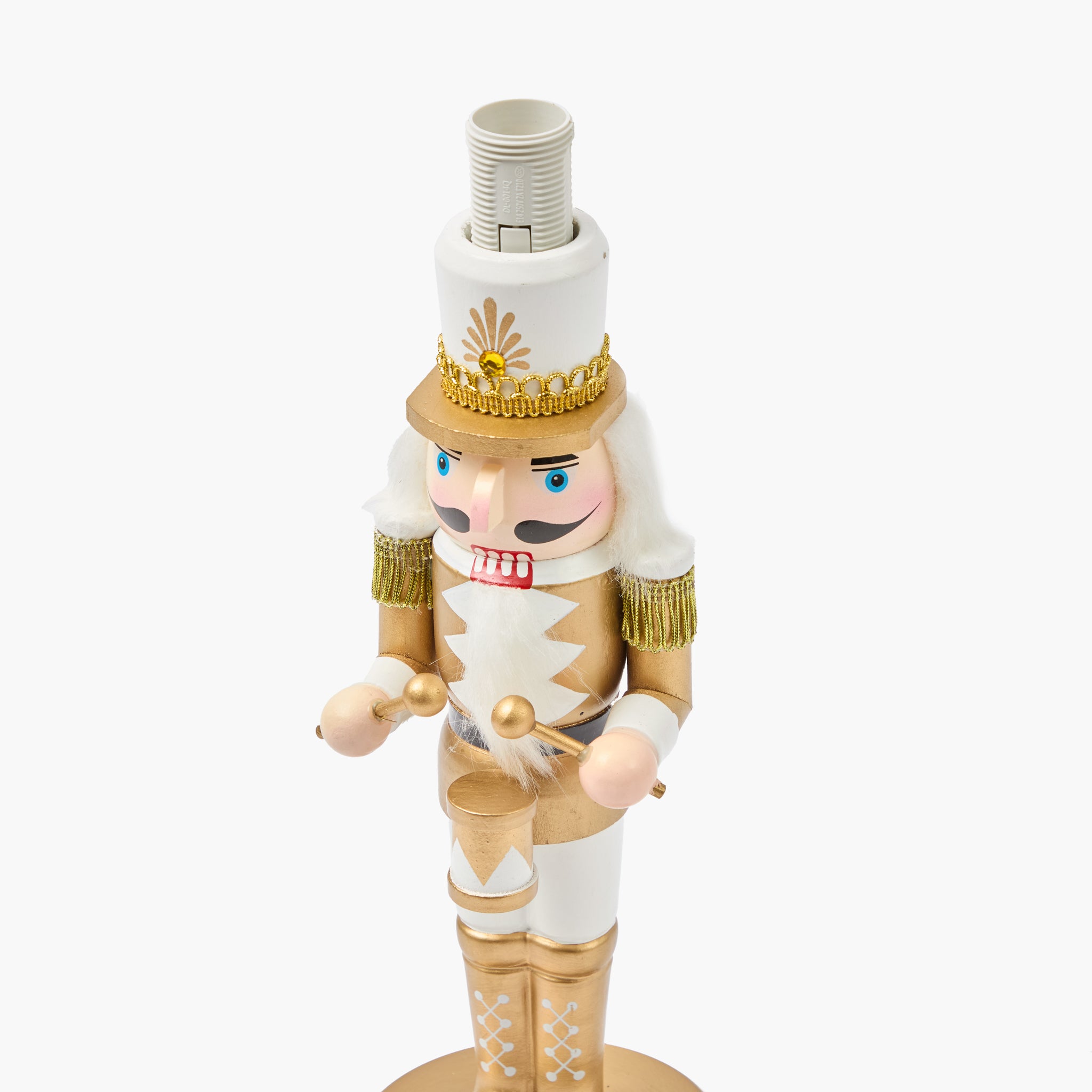 Nutcracker figurine with a lamp on a white background