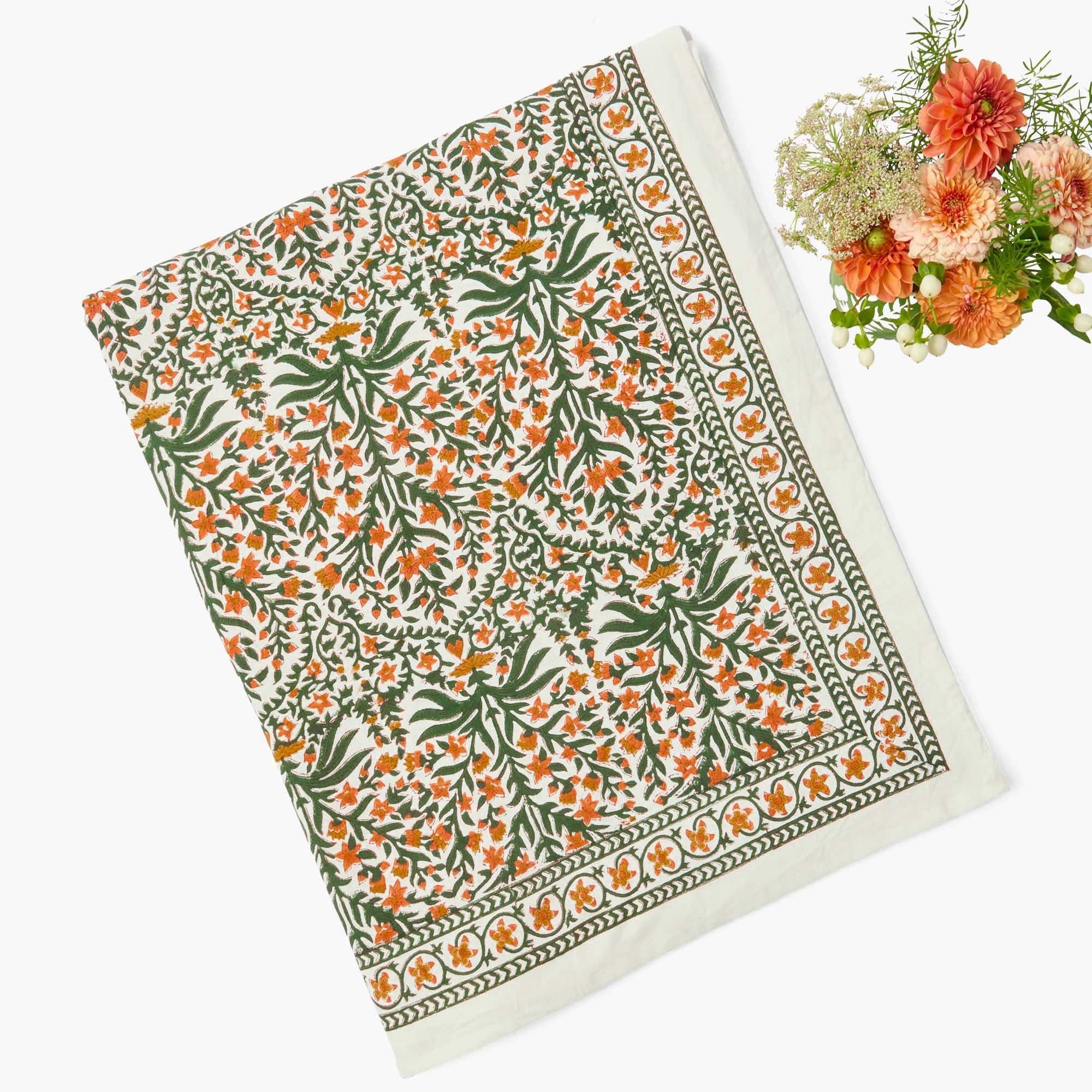 Mrs Alice's Ethel Burnt Orange Tablecloth with floral patterned fabric - orange and green in colour.