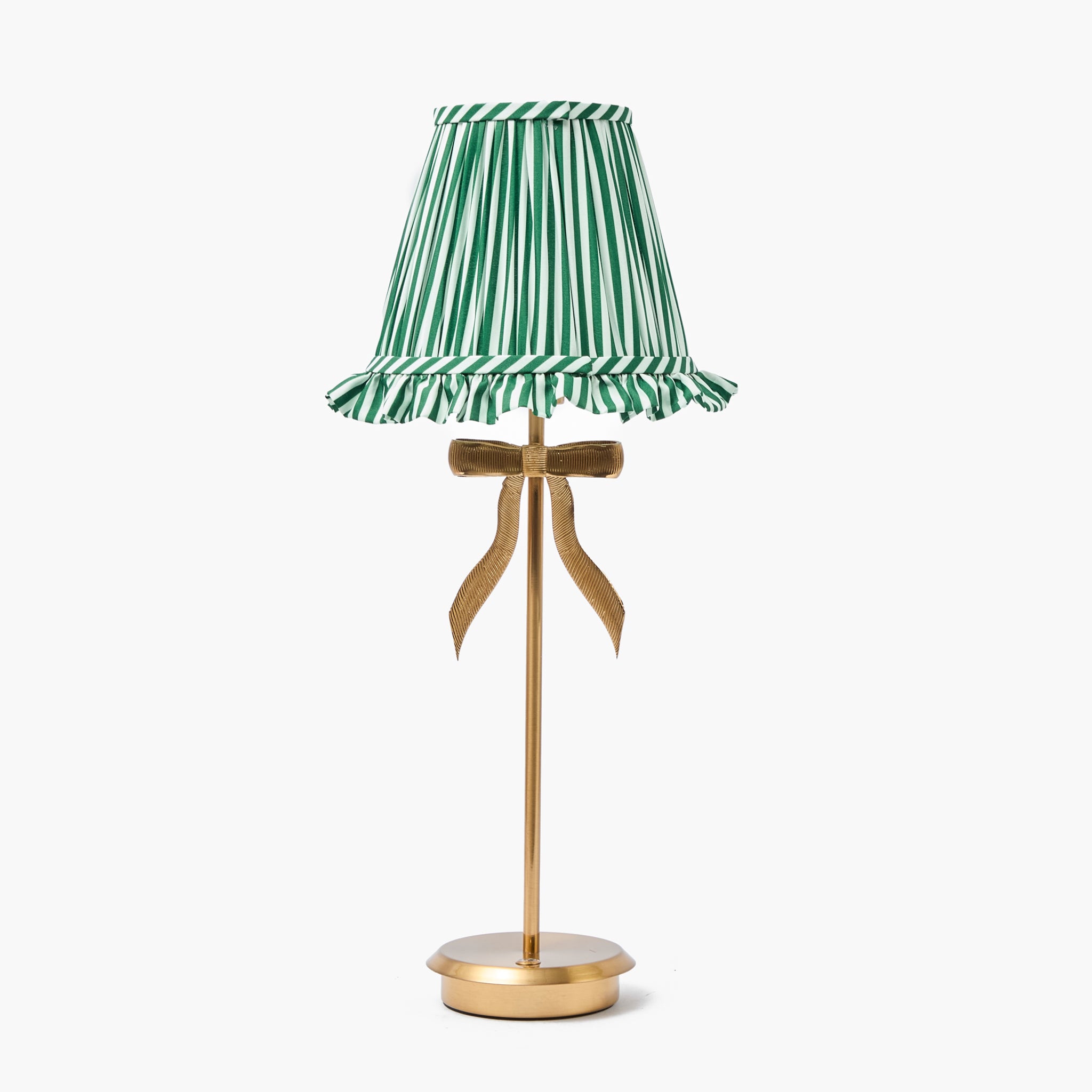 Table lamp with a green and white striped shade and gold base on a white background