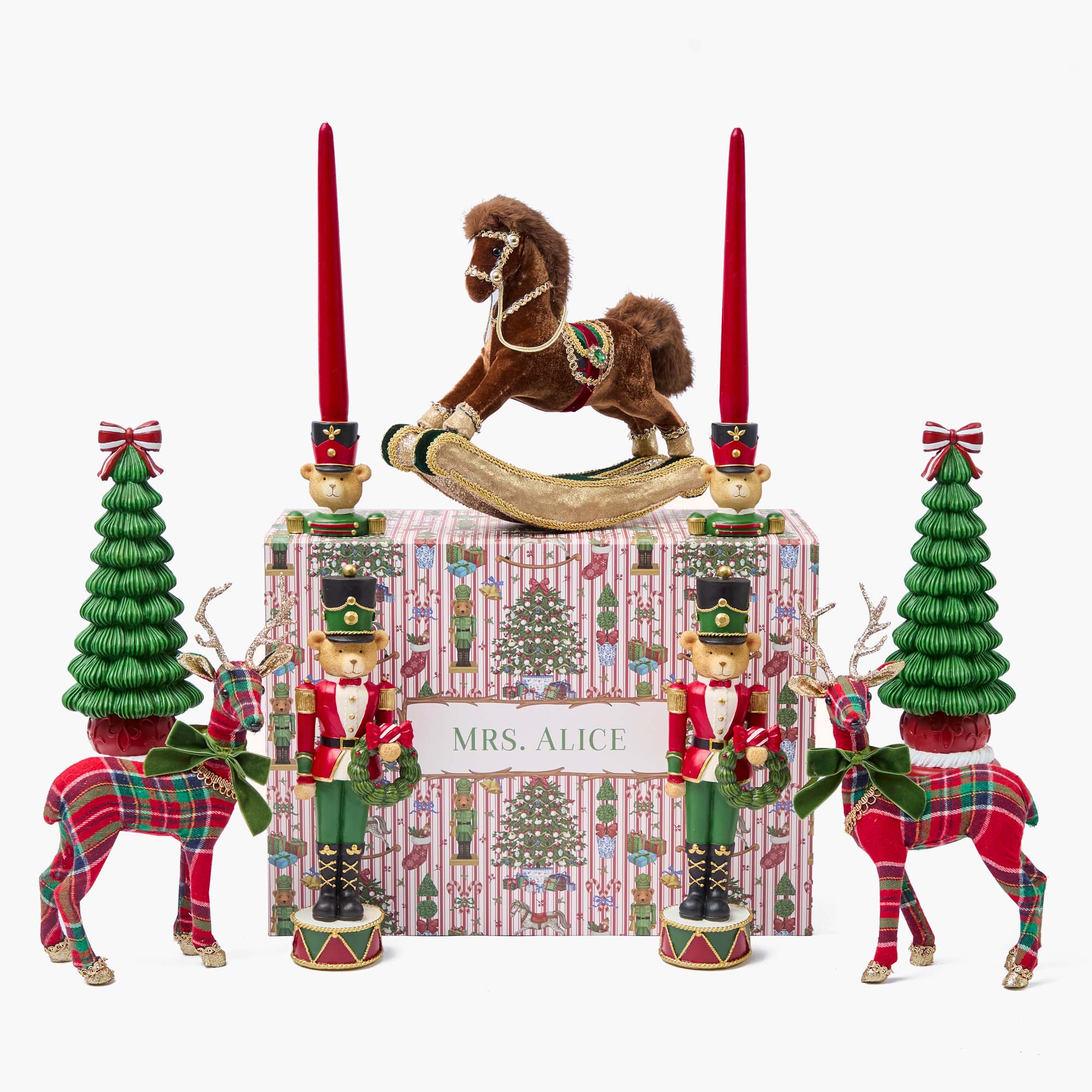 Decorative Christmas set with rocking horse, trees, and nutcrackers on a white background