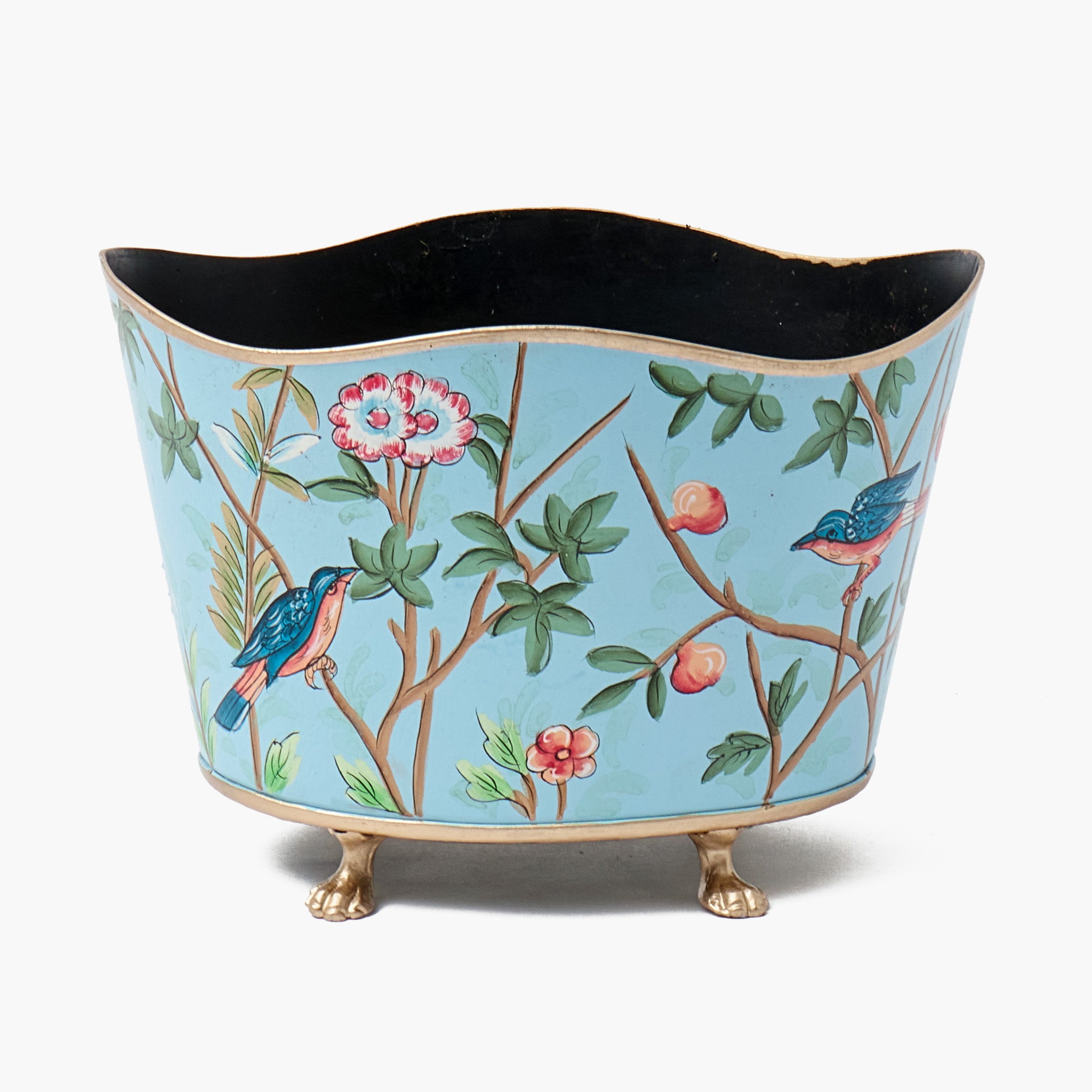 Decorative planter with bird and floral design on a light blue background