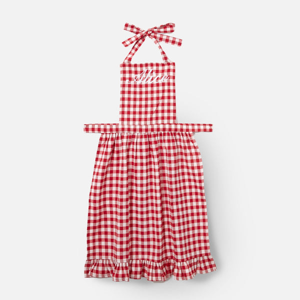 Add a touch of rustic elegance to your kitchen with the Swiss Red Frilled Gingham Apron - a classic choice for the modern homemaker.