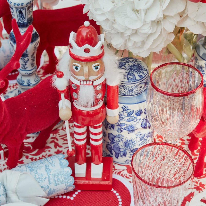 Elevate your Christmas decor with the whimsical and enchanting beauty of the Candy Cane Nutcracker Pair - a simple yet stylish statement of holiday delight.