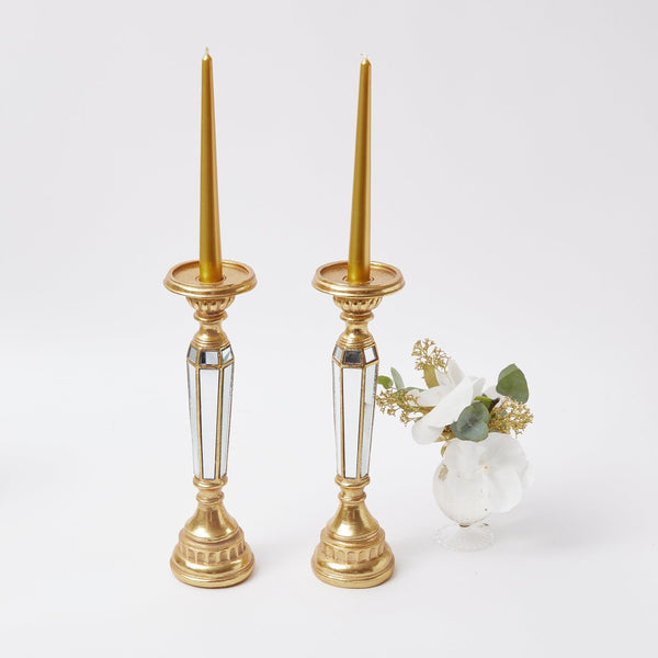 Elevate your decor with the Gold Mirrored Candle Holder Pair, a sophisticated choice to add a touch of opulence to your space.
