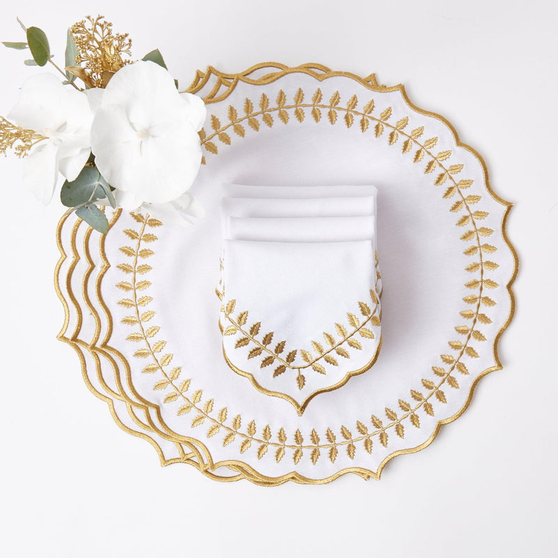 Make each meal a celebration of timeless beauty with the White & Gold Laurel Placemats & Napkins, a perfect set to create a sophisticated and inviting dining atmosphere.