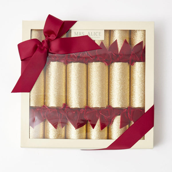 Elevate your holiday gatherings with the Gold Crackers with Red Velvet Bows Set - a set of six that adds a touch of Christmas magic to your celebrations.