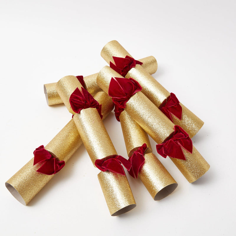 Elevate your Christmas parties with the whimsical and enchanting Gold Crackers with Red Velvet Bows Set - a simple yet stylish statement of holiday sophistication.