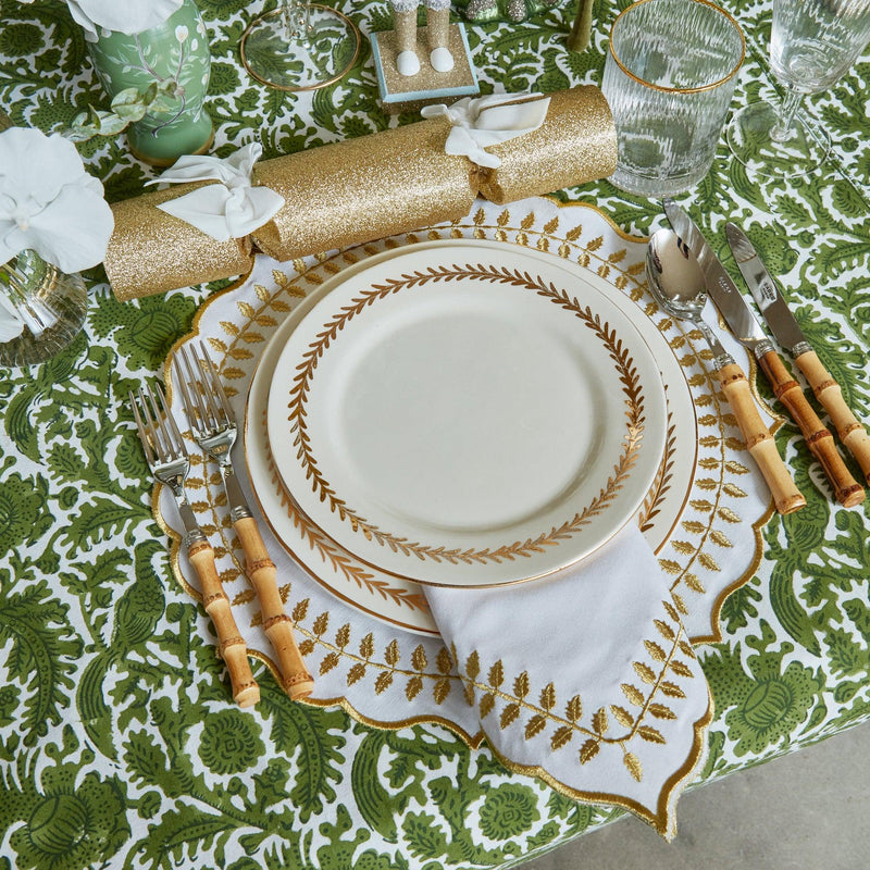 Turn your dining table into an elegant affair with the White & Gold Laurel Placemats, a must-have for adding a touch of opulence and classic beauty to your table decor.
