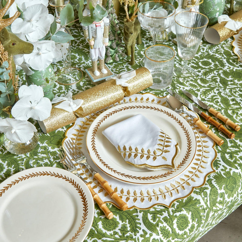 Turn your dining table into an elegant affair with the White & Gold Laurel Placemats & Napkins, a must-have for adding a touch of opulence and classic beauty to your table decor.