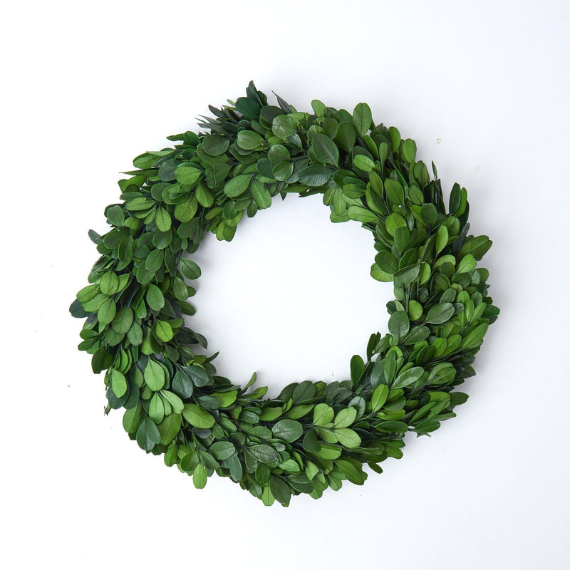 Add a touch of Christmas magic to your home with our Medium Boxwood Wreath - a festive and welcoming decoration for the holiday season.