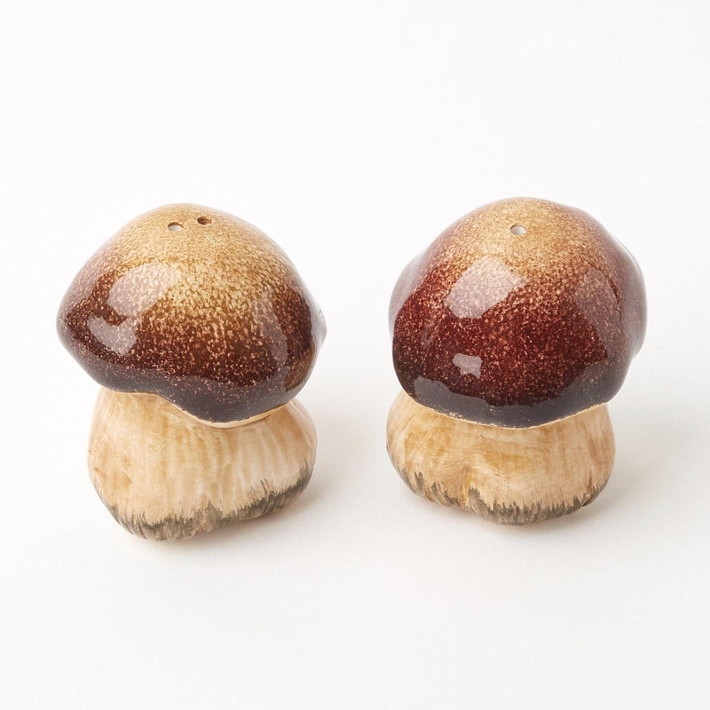 The Porcini Mushroom Salt & Pepper Shaker set brings a touch of rustic charm to your dining table.